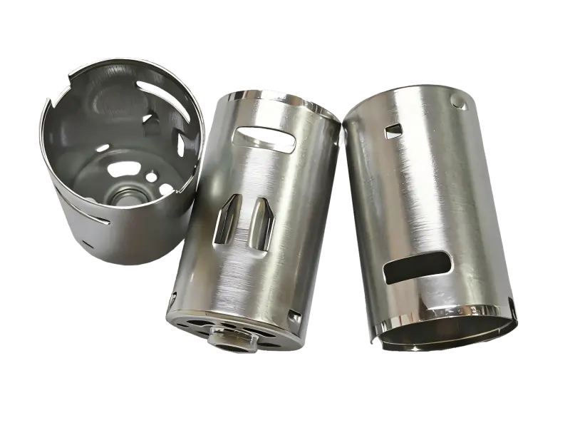Deep drawn stainless steel housing with precision pierced holes and extruded flanges.