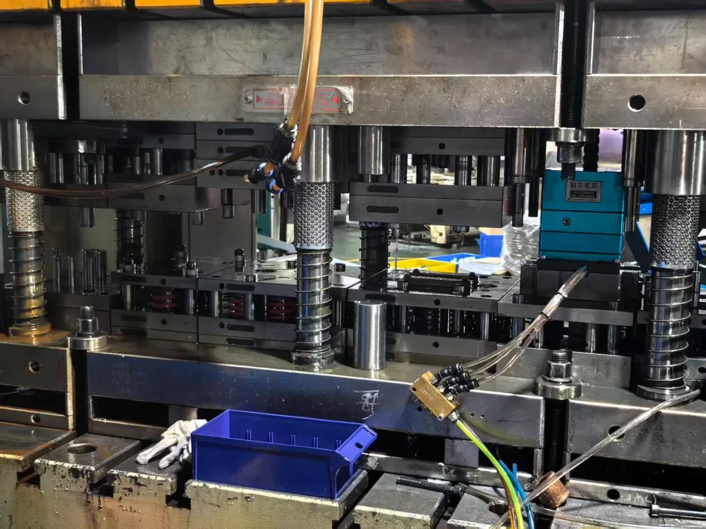compound die stamping tooling installed in a precision metal stamping press